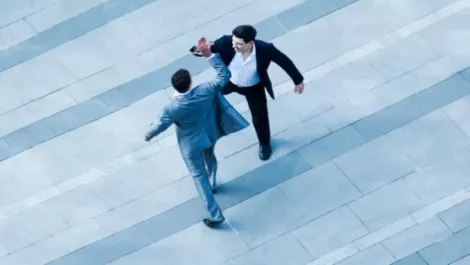 Business men high five