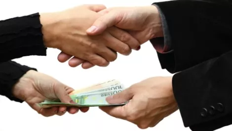 Shaking hands plus money