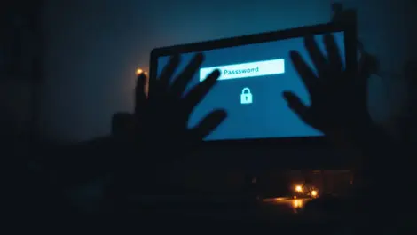 Worried uk computer user password security risk shadowy hands reach